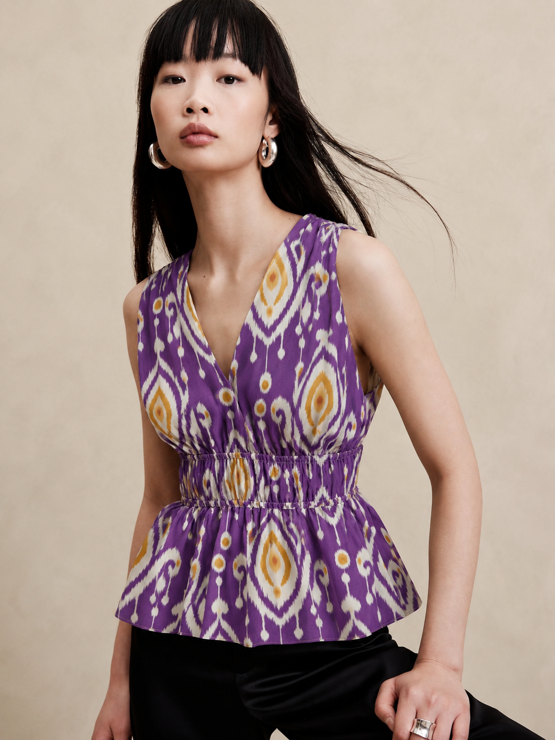 Women's Purple Ikat Print Sleeveless V-Neck Peplum Top